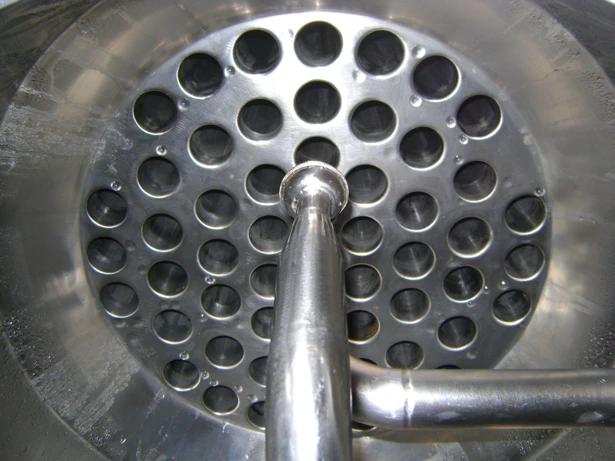 Falling Film evaporator tube sheet — central distribution nozzle